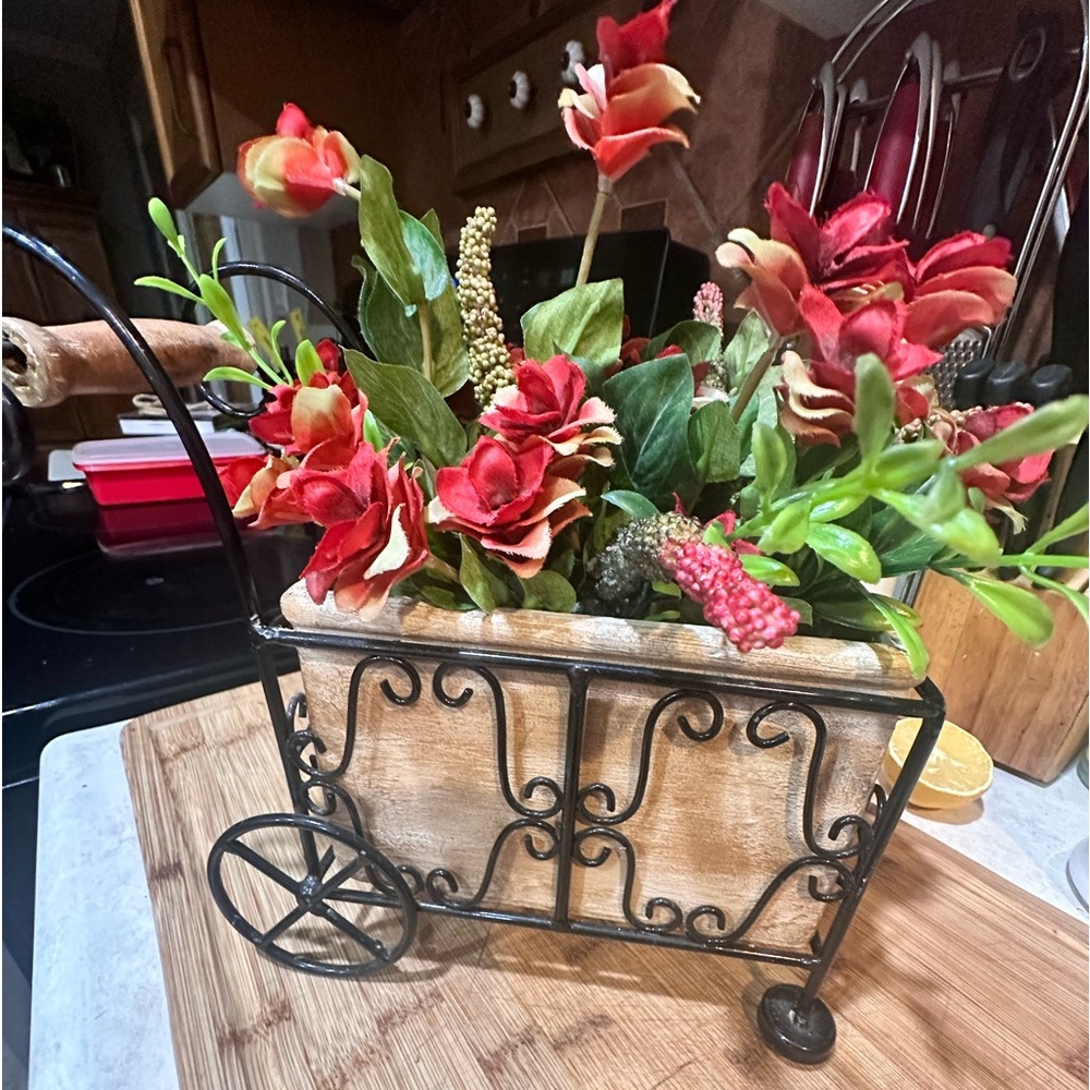 Handcrafted ceramic cart with metal carriage with florals